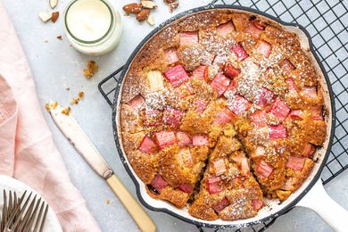 Almond Flour Cake Recipes - almond cake in skillet with cream nearby