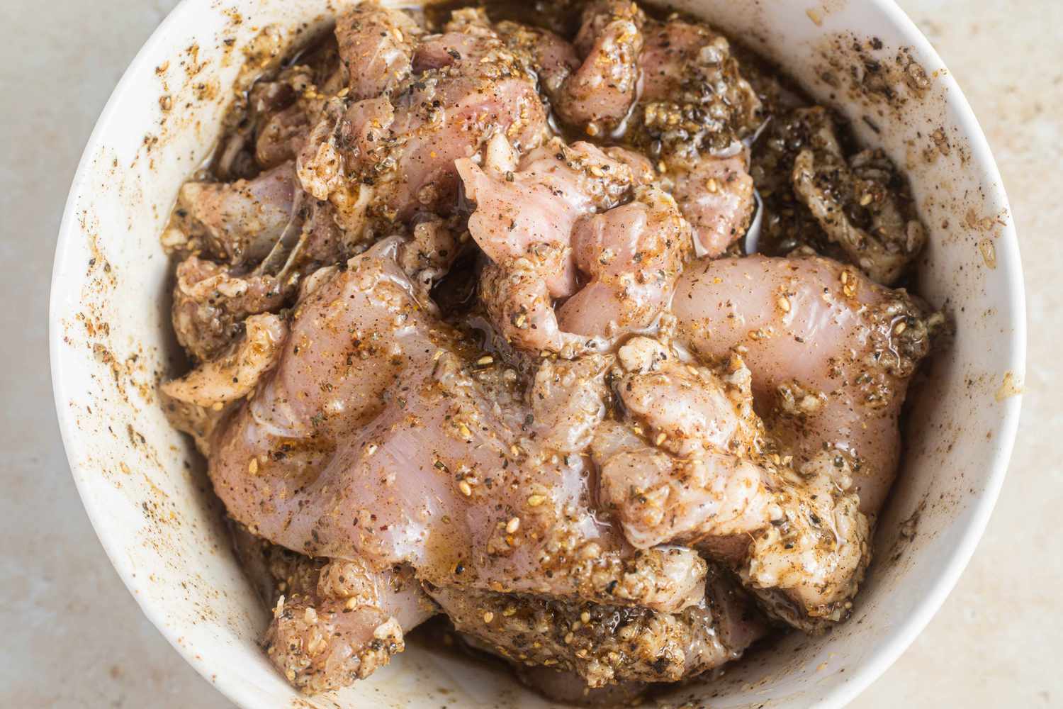 Bowl of Chicken Marinating for Halal Cart-Style Chicken Over Rice Recipe