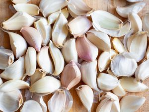 Garlic Cloves on a Cutting Board for Pickled Garlic Recipe