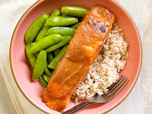 Triple M Salmon Served With Brown Rice and Edamame in a Bowl With a Fork